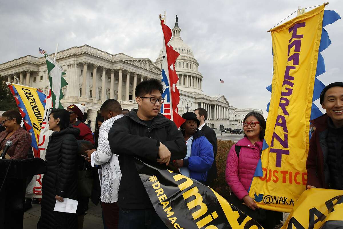 People rally outside the Capitol in support of the Deferred Action for Childhood Arrivals (DACA), and Temporary Protected Status (TPS), programs Tuesday, Dec. 5, 2017, on Capitol Hill in Washington. (AP Photo/Jacquelyn Martin)