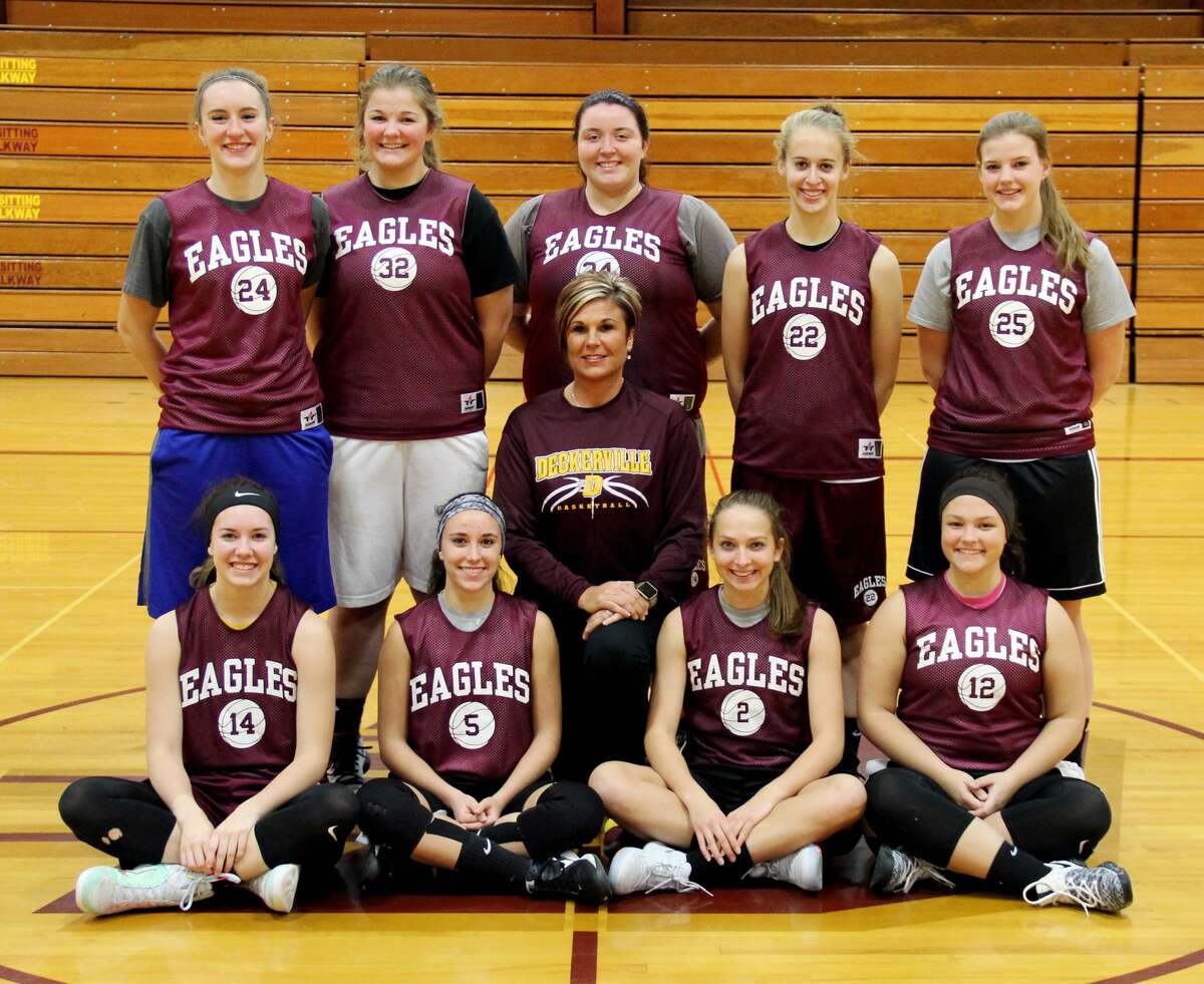 p.p1 {margin: 0.0px 0.0px 0.0px 0.0px; line-height: 10.8px; font: 10.0px Helvetica} Members of the Deckerville girls basketball team are (from row from left) Emma Morningstar, Madisyn Guza, assistant coach Amy Foote, Kylee Colesa, Liz Binder, (back row) Charlotte Schulz, Haileigh Foote, Kaylynn Schtz, Morgan Armstead and Julia Flanagan. Missing is head coach Pat Oswald. (Chip Burch/Huron Daily Tribune)