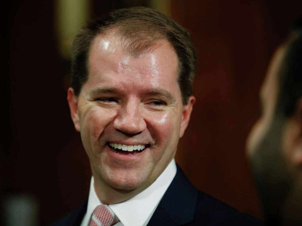Don Willett laughs as he arrives before a Senate Judiciary Committee hearing on nominations on Capitol Hill in Washington, Wednesday, Nov. 15. Willett has been nominated to the United States Circuit Judge For The Fifth Circuit. (AP Photo/Carolyn Kaster)