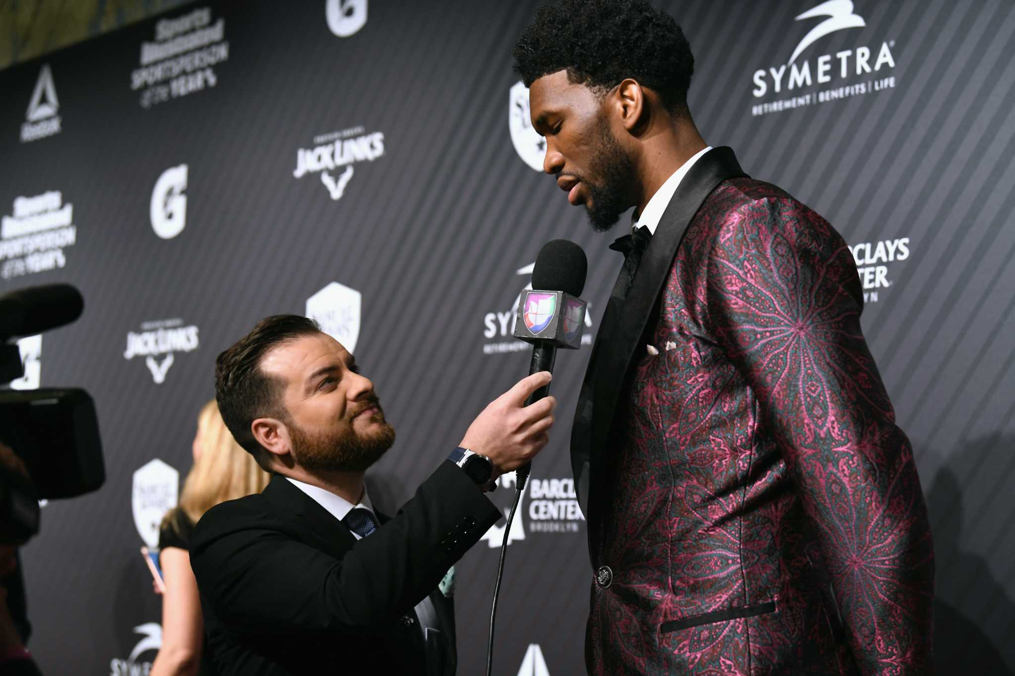 5-foot-6 Jose Altuve stood next to 7-foot Joel Embiid