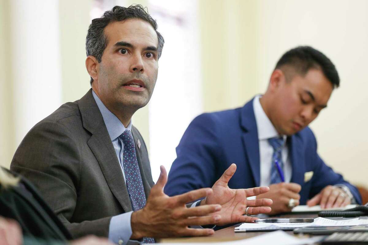 Texas Land Commissioner George P. Bush, left, talks to Fort Bend County representatives and representatives from cities in Fort Bend County during a roundtable discussion about the state of housing recovery after Hurricane Harvey at the Historic Courthouse Tuesday, Nov 28, 2017 in Richmond. ( Michael Ciaglo / Houston Chronicle)