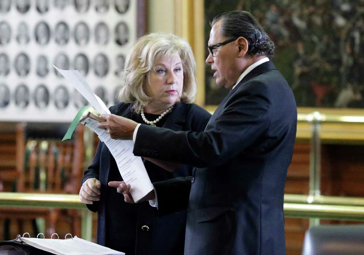 Senators Jane Nelson and Senator Jose Rodriguez go over the legislation as the Texas Senate takes up its budget proposal on the floor in the Capitol on March 28, 2017.