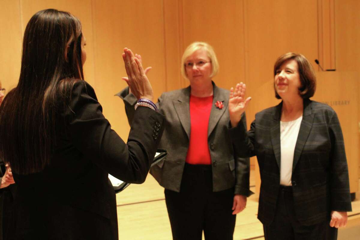Newly elected selectman Deborah McFadden and re-elected selectman Lori Bufano are sworn in on Thursday, Nov. 30, 2017.