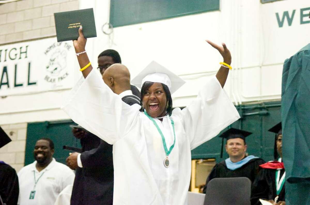 Leathia Lilia Johnson celebrates receiving her diploma during the Norwalk High School Class of 2010 graduation Monday, June 28, 2010.