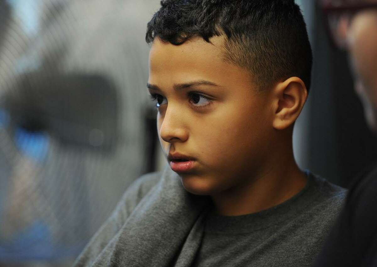 Hartford School District: 291 students displaced as of 12-1-17 Pictured: Juan Casiano, 12, from Bayamon, Puerto Rico, at City Hall in Bridgeport, Conn. on Thursday, October 5, 2017. Casiano and his brother, who are staying with Bridgeport relatives following the devastating hurricane in Puerto Rico, will begin attending Luis Munoz Marin School next week.