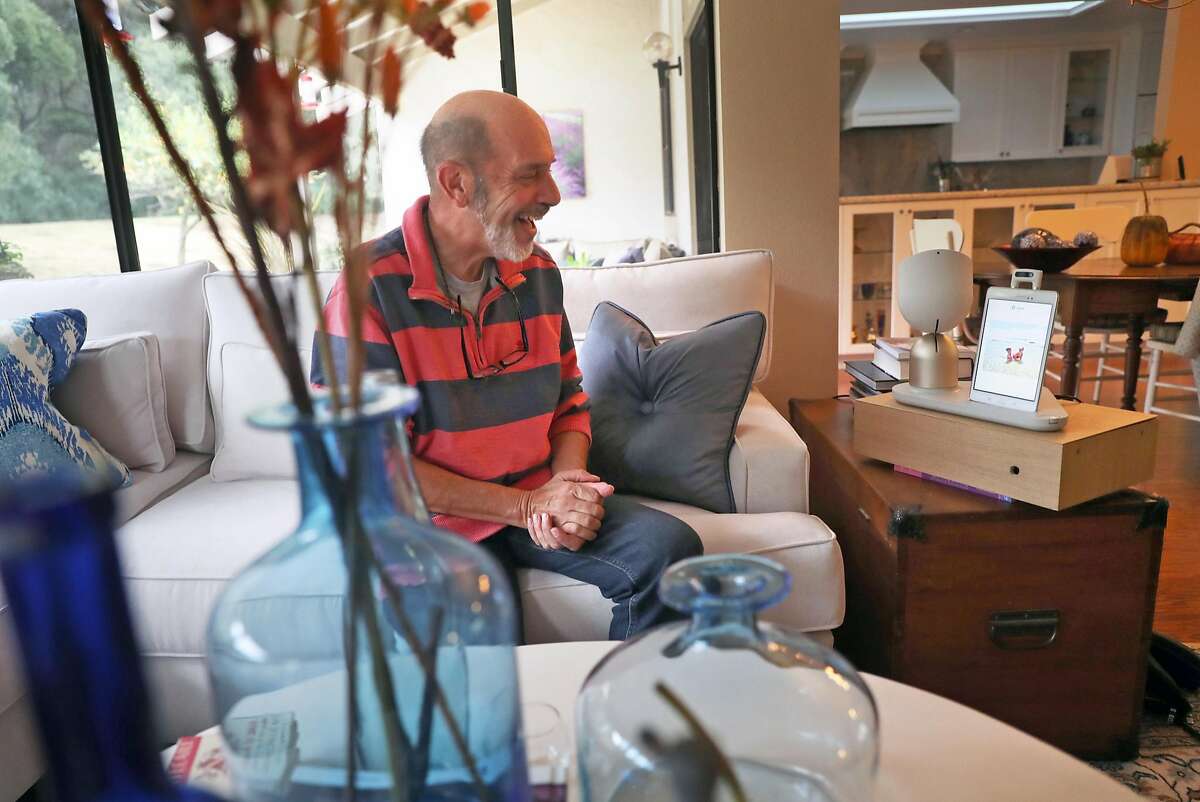 Barry Sardis tests ElliQ, after receiving the robot built to improve the quality of senior citizen's lives, at his residence in San Jose, Calif., on Monday, November 20, 2017.