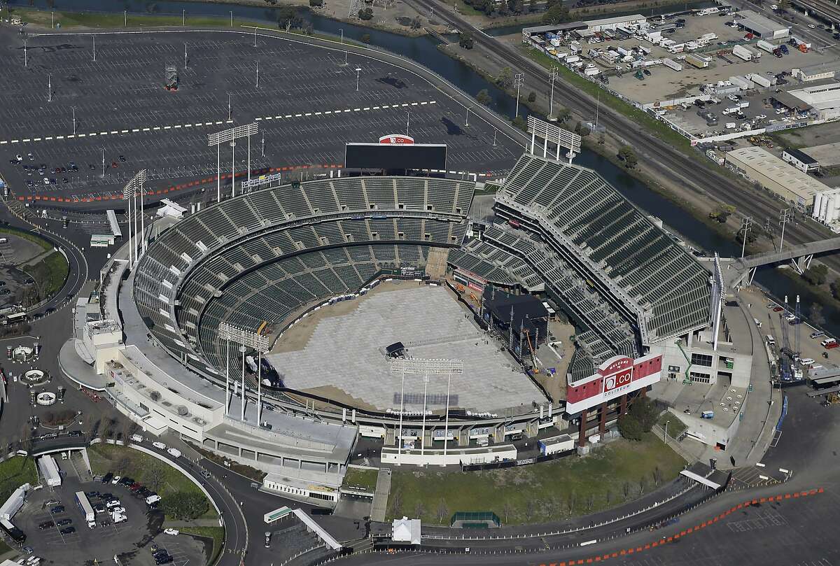 FILE - This Feb. 5, 2016, file photo shows the Oakland–Alameda County Coliseum, home to the Oakland Athletics, in Oakland, Calif. The Athletics are left to consider yet another site to build a new ballpark after the team's top choice of location near Laney College fell through with the board of Peralta Community College District. A's President Dave Kaval and his team had considered this the top spot and had engaged in conversations with community members, officials and business owners in the area in hopes of building a privately financed ballpark to open as soon as 2023. (AP Photo/Eric Risberg, File)