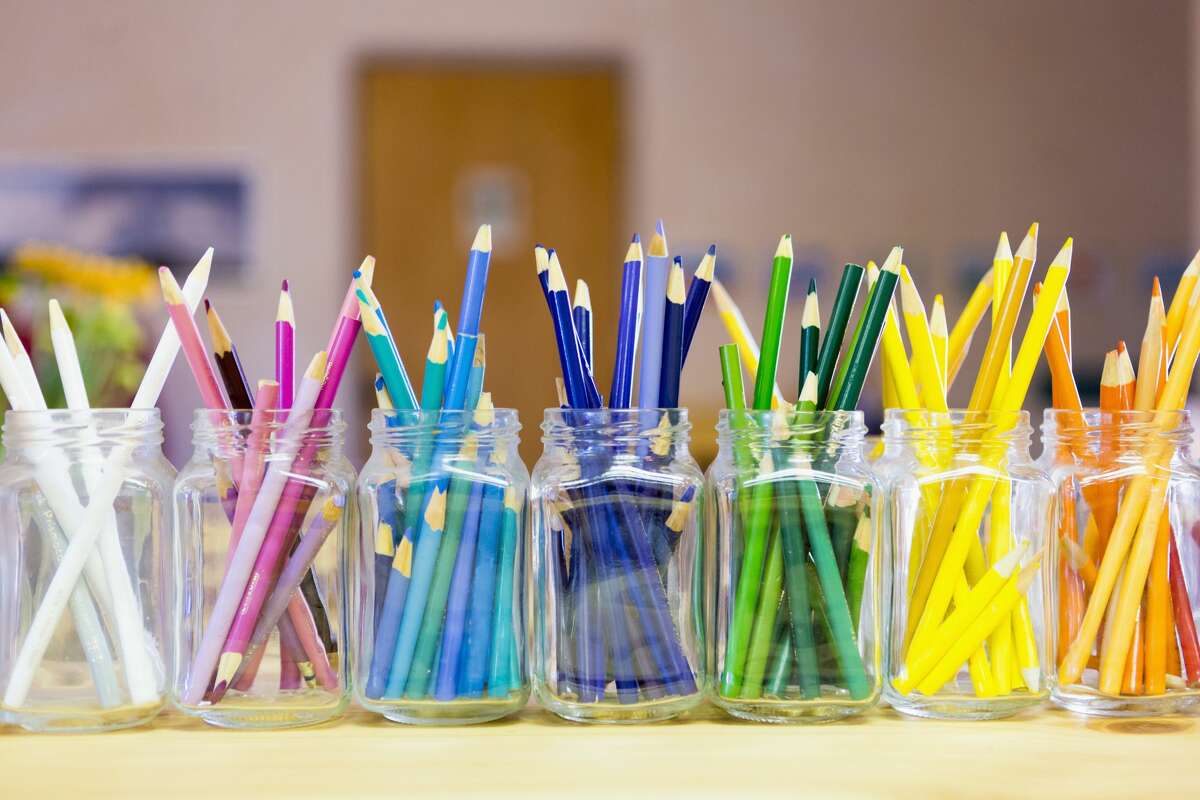 Close up of multicolor pencils organized in jars
