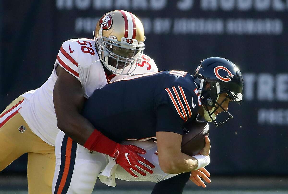 CHICAGO, IL - DECEMBER 03: Quarterback Mitchell Trubisky #10 of the Chicago Bears is sacked by Elvis Dumervil #58 of the San Francisco 49ers in the first quarter at Soldier Field on December 3, 2017 in Chicago, Illinois. (Photo by Jonathan Daniel/Getty Images)