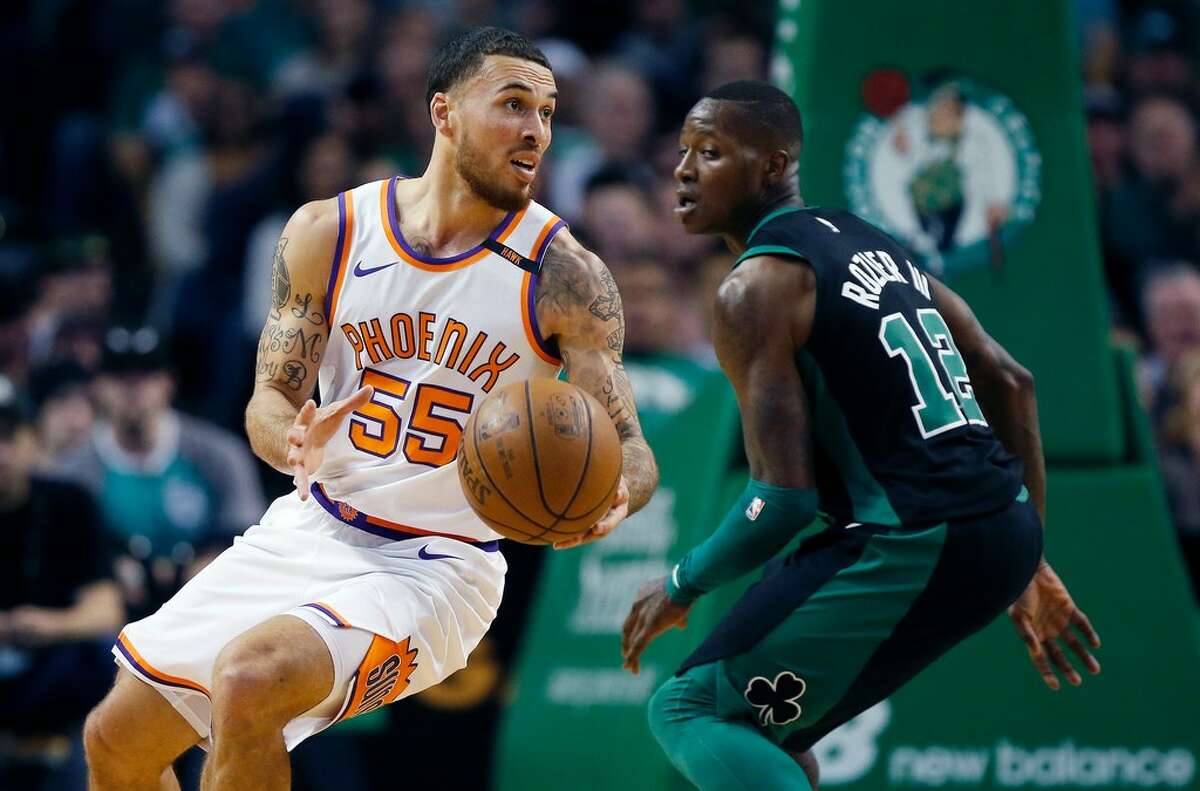 Phoenix Suns' Mike James (55) pivots beside Boston Celtics' Terry Rozier (12) during the fourth quarter of an NBA basketball game in Boston, Saturday, Dec. 2, 2017. The Celtics won 116-111. (AP Photo/Michael Dwyer)
