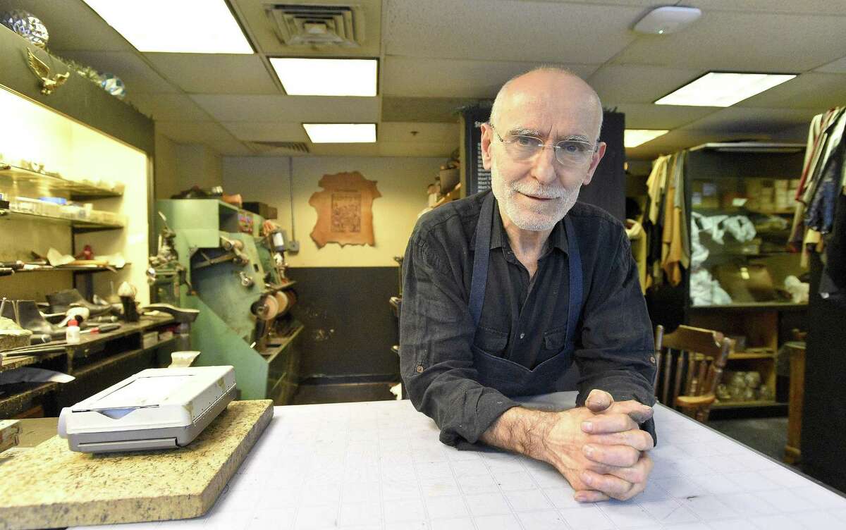 Izet Music, owner of Izet's Leather and Shoe Repair is photographed on Dec. 7, 2017, at his shop at 60 Atlantic St., in Stamford, Conn. Retailers are adapting to the challenge of e-commerce and remain committed to operating in downtown.