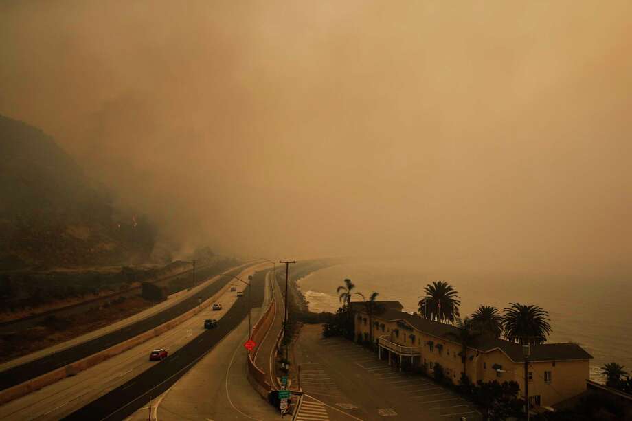 If you are advised to stay indoors, close all your windows and run the air conditioner. If it is too hot to stay inside, seek other shelter.  Photo: Jae C. Hong, STF / Copyright 2017 The Associated Press. All rights reserved.
