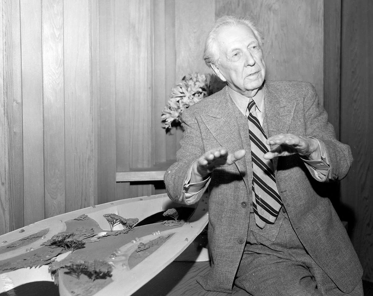 April 23, 1955: Famed architect Frank Lloyd Wright poses with his "Butterfly Bridge" design in 1955. The bridge was designed as an unbuilt southern crossing between San Francisco and the East Bay.