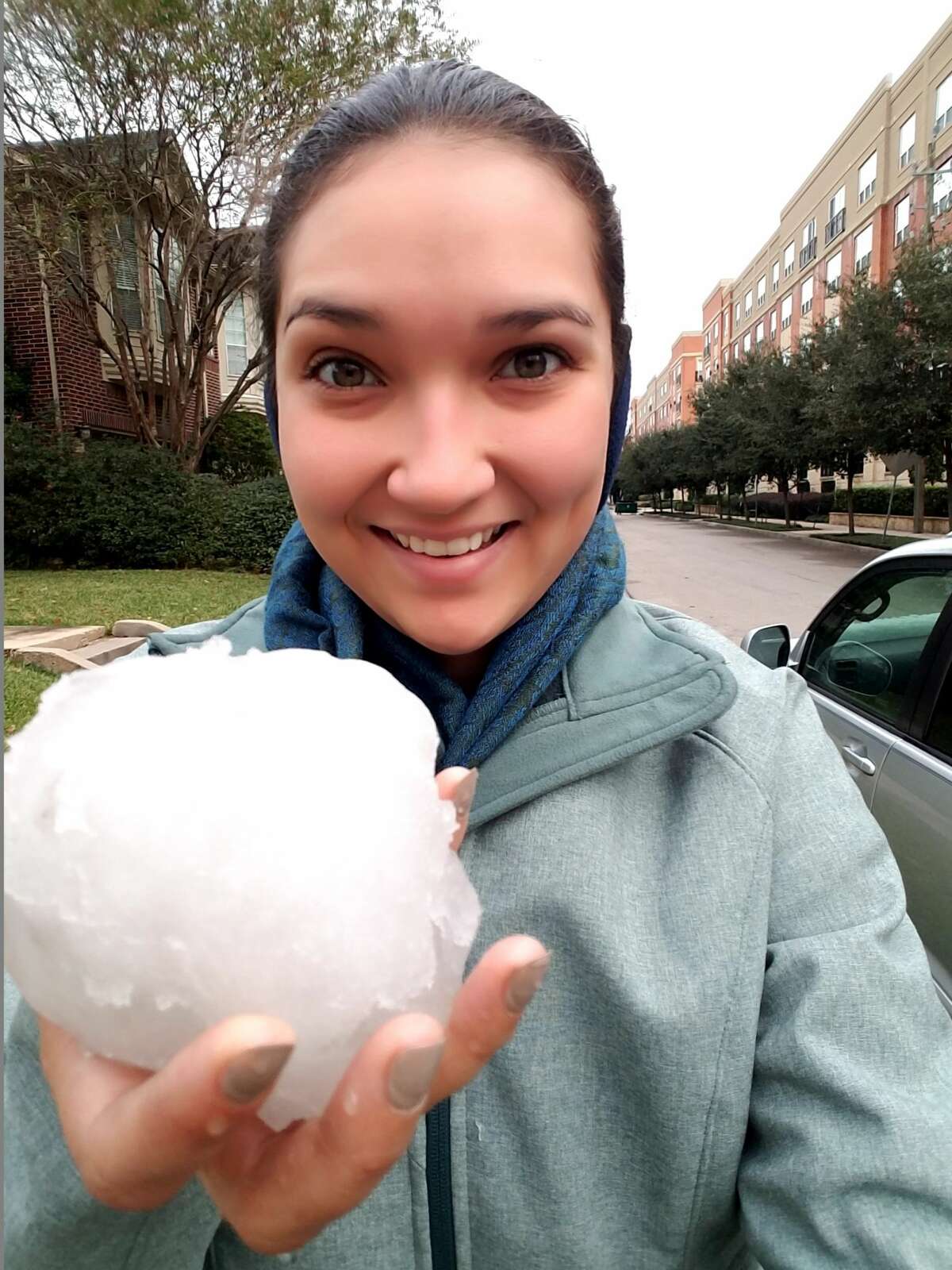 Houston Chronicle staffer Heather Leighton can't contain her excitement and pride over her snowball.