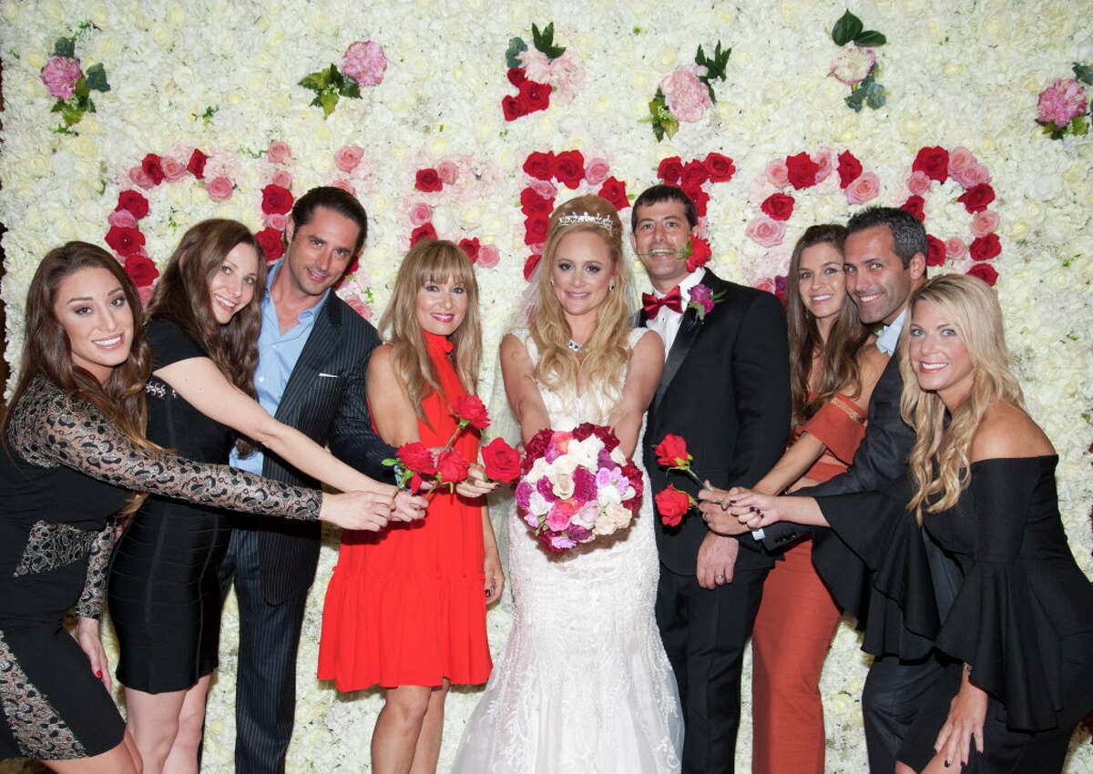 "Bachelor Nation" descended upon Houston for reality star Erica Rose's wedding day. The Bayou City native asked her now-husband Charles Sanders to propose to her daughter, Holland Gentry, too; Rose and Gentry walked down the aisle at Congregation Emanu El together. Rose and Sanders, who first met in high school, celebrated with not one, but two fun-filled receptions. The second party took place downtown at the Majestic Metro.