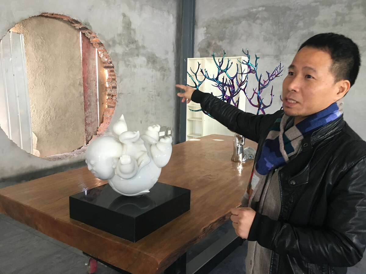 Artist Giao Xiaowu gives a tour of his new studio on a tour arranged by the Peninsula Hotel, Beijing, which also displays his sculptures.