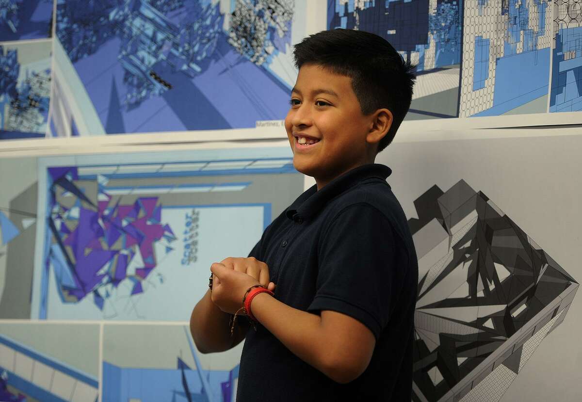 Sixth grader Joel Gonzalez-Lituma, 11, presents his architecture project that he completed as part of the Thom Mayne Young Architects program at Hall School in Bridgeport, Conn. on Tuesday, December 5, 2017. Students learned to use a computer design program to artistically reimagine their classroom space.