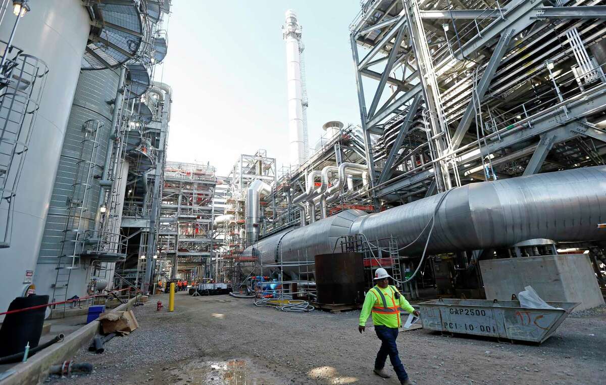 FILE - In this Nov. 16, 2015 file photo, a worker walks through a section of the Mississippi Power Co. carbon capture plant in DeKalb, Miss. Regulators have reached a settlement with Mississippi Power Co. on how much customers should pay for a troubled $7.5 billion power plant once touted as the future of coal. The unit of Atlanta-based Southern Co. is agreeing to lower the price tag on its Kemper County power plant by $85 million, its second round of concessions in two weeks. Shareholders have already lost $6 billion. (AP Photo/Rogelio V. Solis, File)