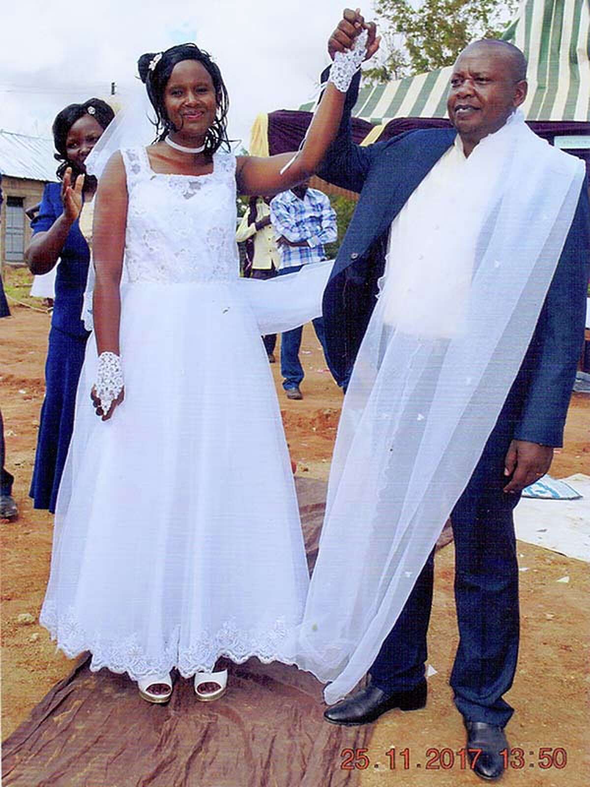 Pastor Samson Mulinge Mutuse celebrates his wedding to Evelyn Mueni Mulinge at Deliverance Church in Nthange, Kenya, on Nov. 25. Each lost a first spouse to AIDS.