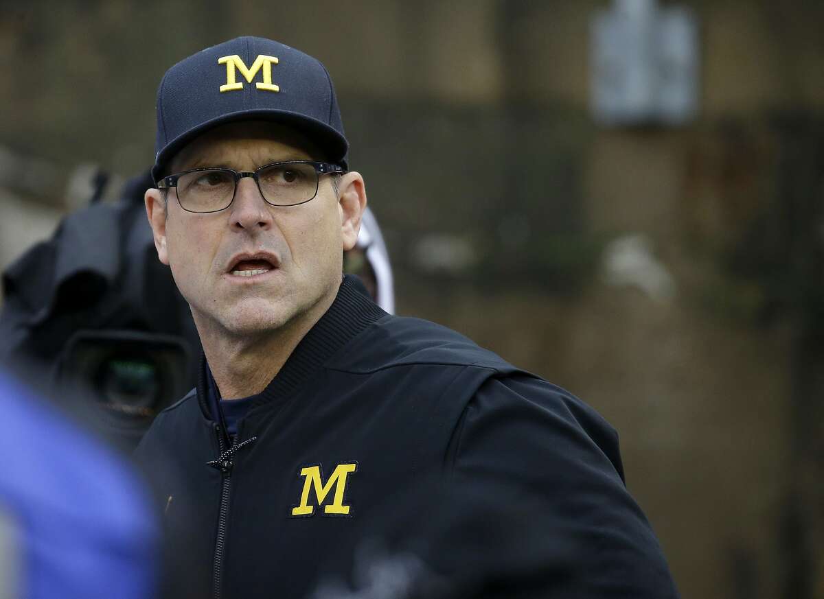 Michigan head coach Jim Harbaugh before an NCAA college football game against Wisconsin Saturday, Nov. 18, 2017, in Madison, Wis. (AP Photo/Aaron Gash)