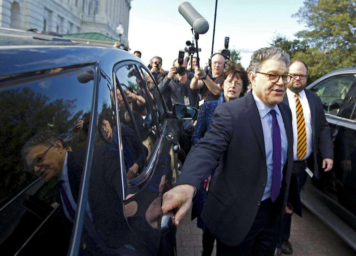 Sen. Al Franken, D-Minn., center, holds hands with his wife Franni Bryson as he leaves the Capitol after speaking on the Senate floor, Thursday, Dec. 7, 2017, on Capitol Hill in Washington. Franken said he will resign from the Senate in coming weeks following a wave of sexual misconduct allegations and a collapse of support from his Democratic colleagues, a swift political fall for a once-rising Democratic star. ( AP Photo/Jose Luis Magana)