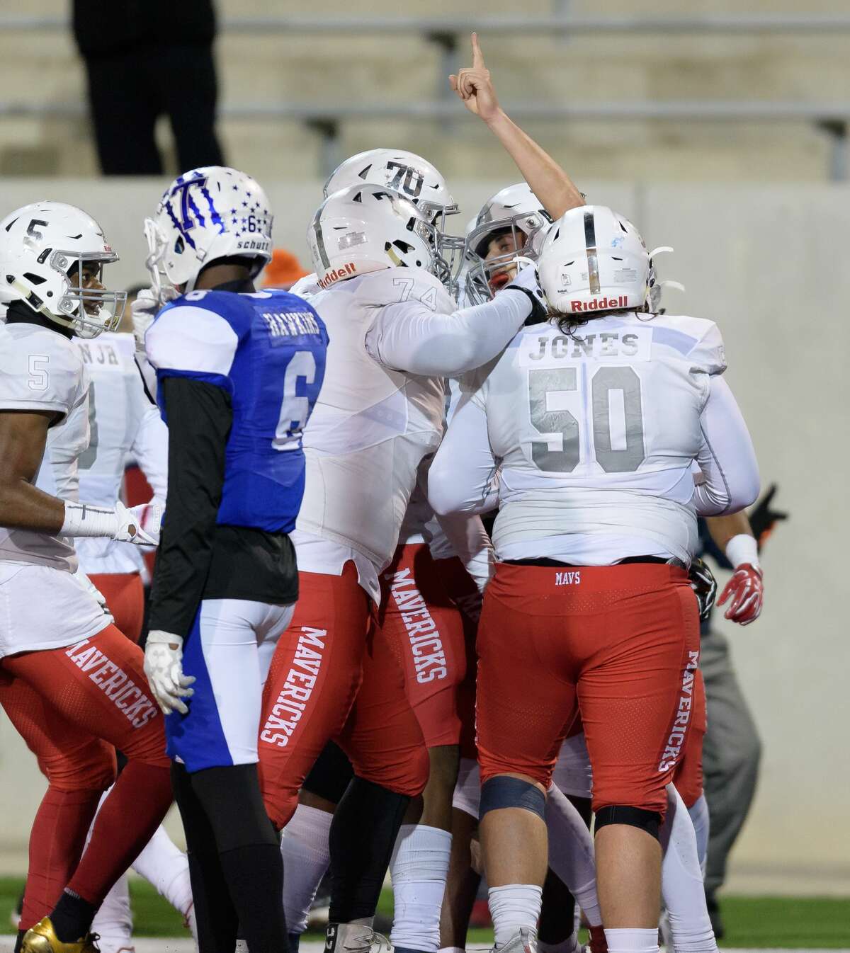 Kason Martin (12) of the Manvel Mavericks celebrates his touchdown in the second half with Lance Jones (50), Steven Shaw (70), and Jalen Momerelle (74) in a game against the Temple Wildcats in a high school football game on Friday, December 8, 2017 at Blackshear Field at Prairie View A&M University.