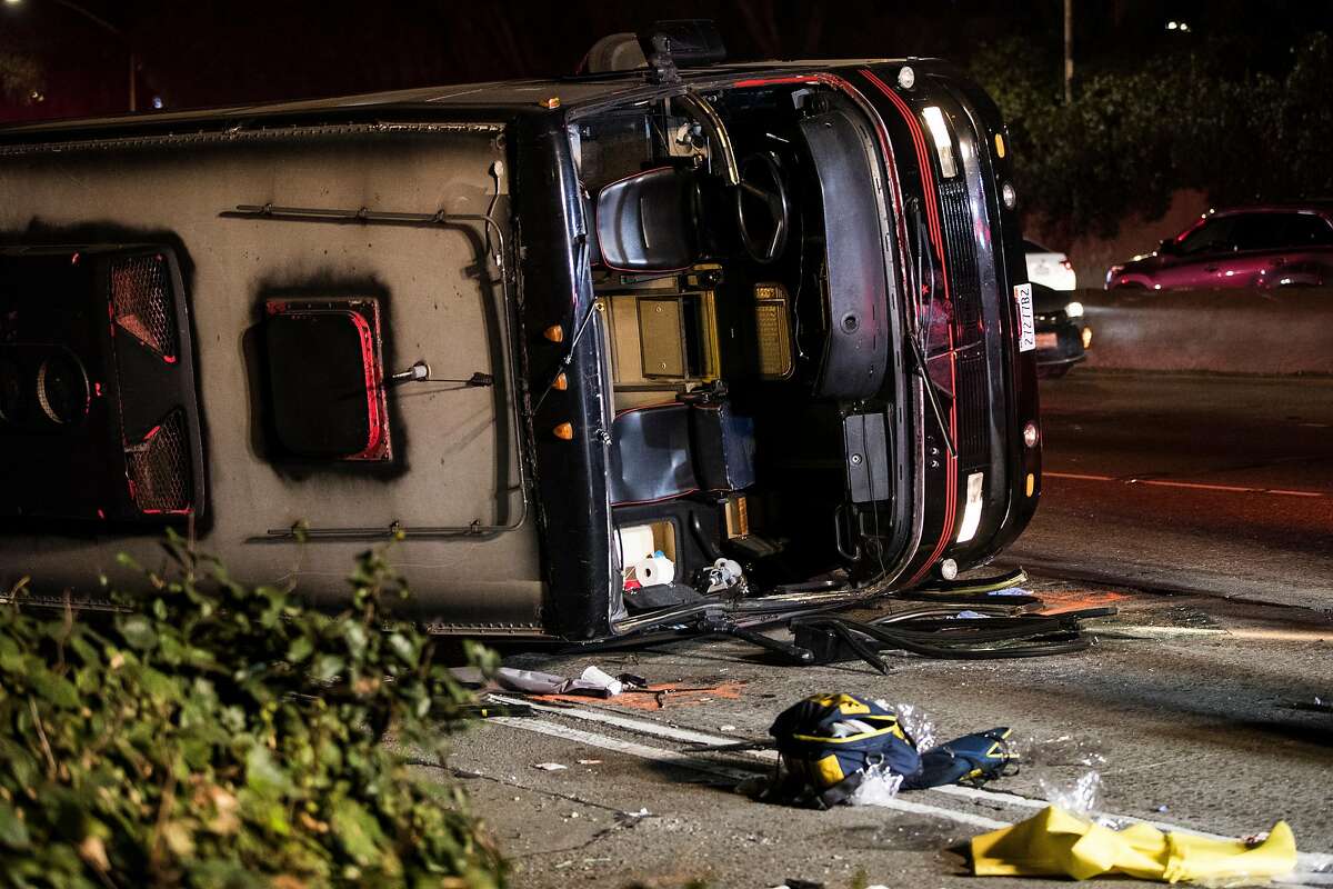 An overturned passenger bus is seen on southbound Highway101 north of Cesar Chavez Boulevard in San Francisco, Calif. on Friday, Dec. 8, 2017.