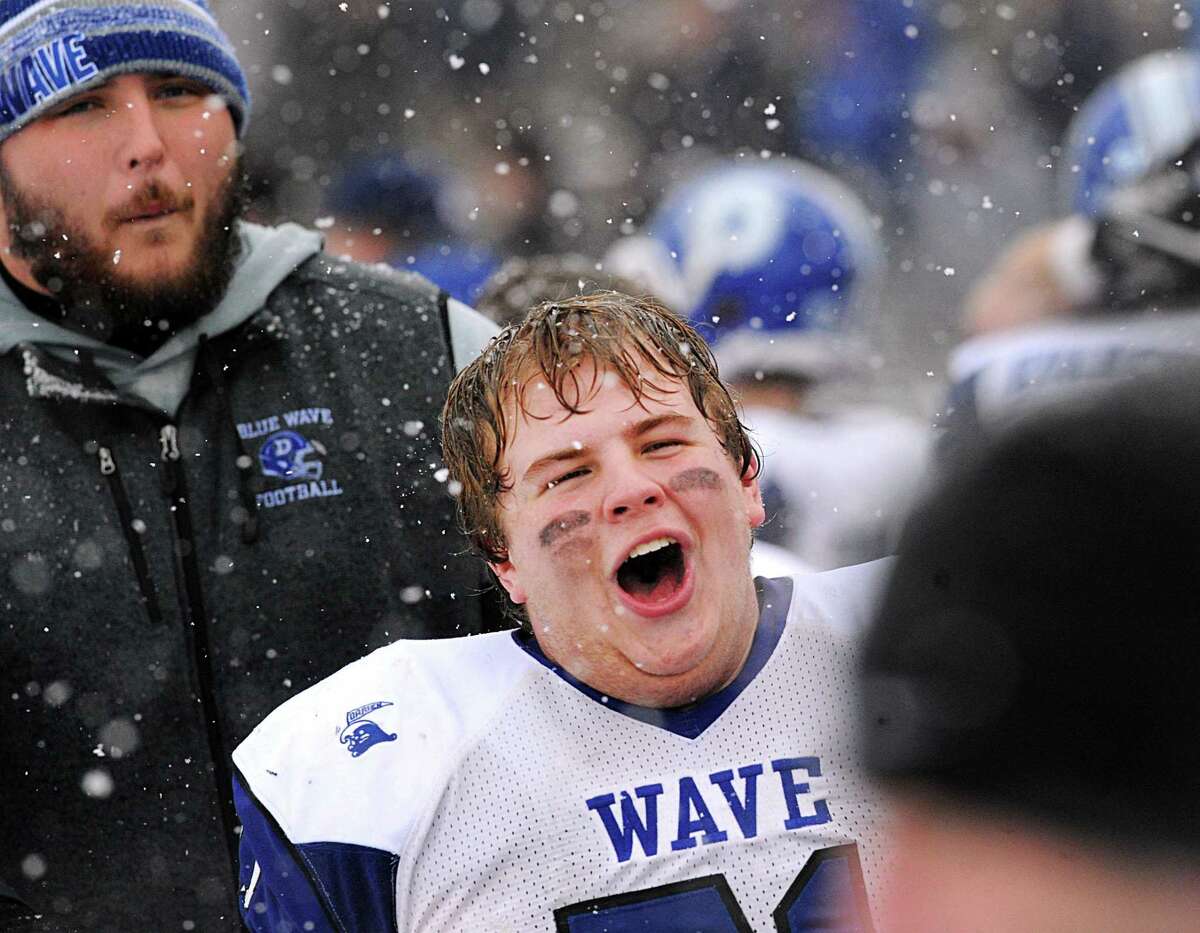 Darien's Charlie Zuro (#71) reacts at the end of the Class LL high school championship football game between Greenwich High School and Darien High School at Boyle Stadium in Stamford, Conn., Saturday, Dec. 9, 2017. Darien took the state title defeating Greenwich, 31-22.