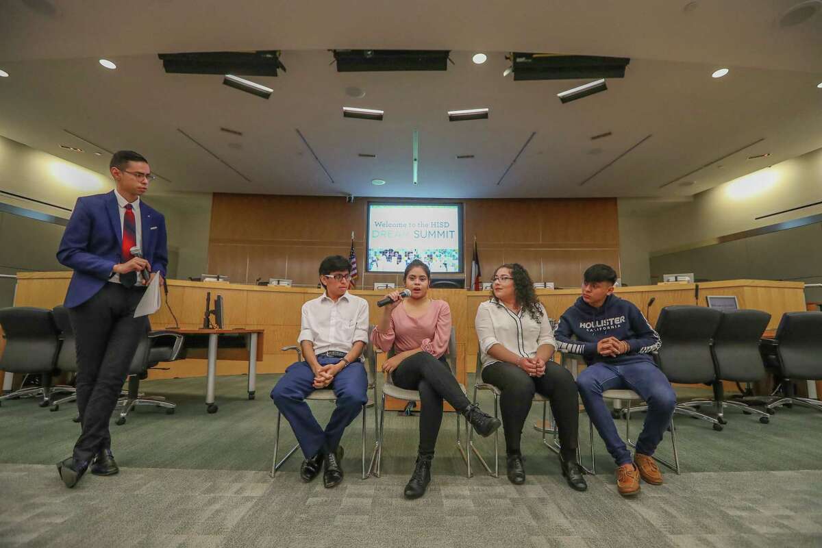 Antonio Arellano, from left, leads former HISD students Kleyder Sanchez, Jaquelin Sanchez, Jessica Chavez and Maykd Garcia in a panel discussion at HISD's third-annual Dream Summit on Saturday.