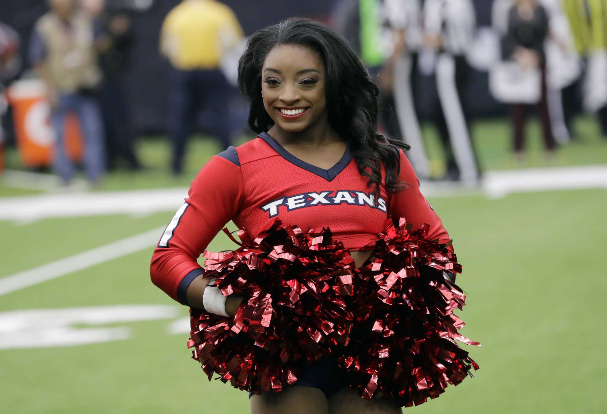 Simone Biles appears as guest Texans cheerleader