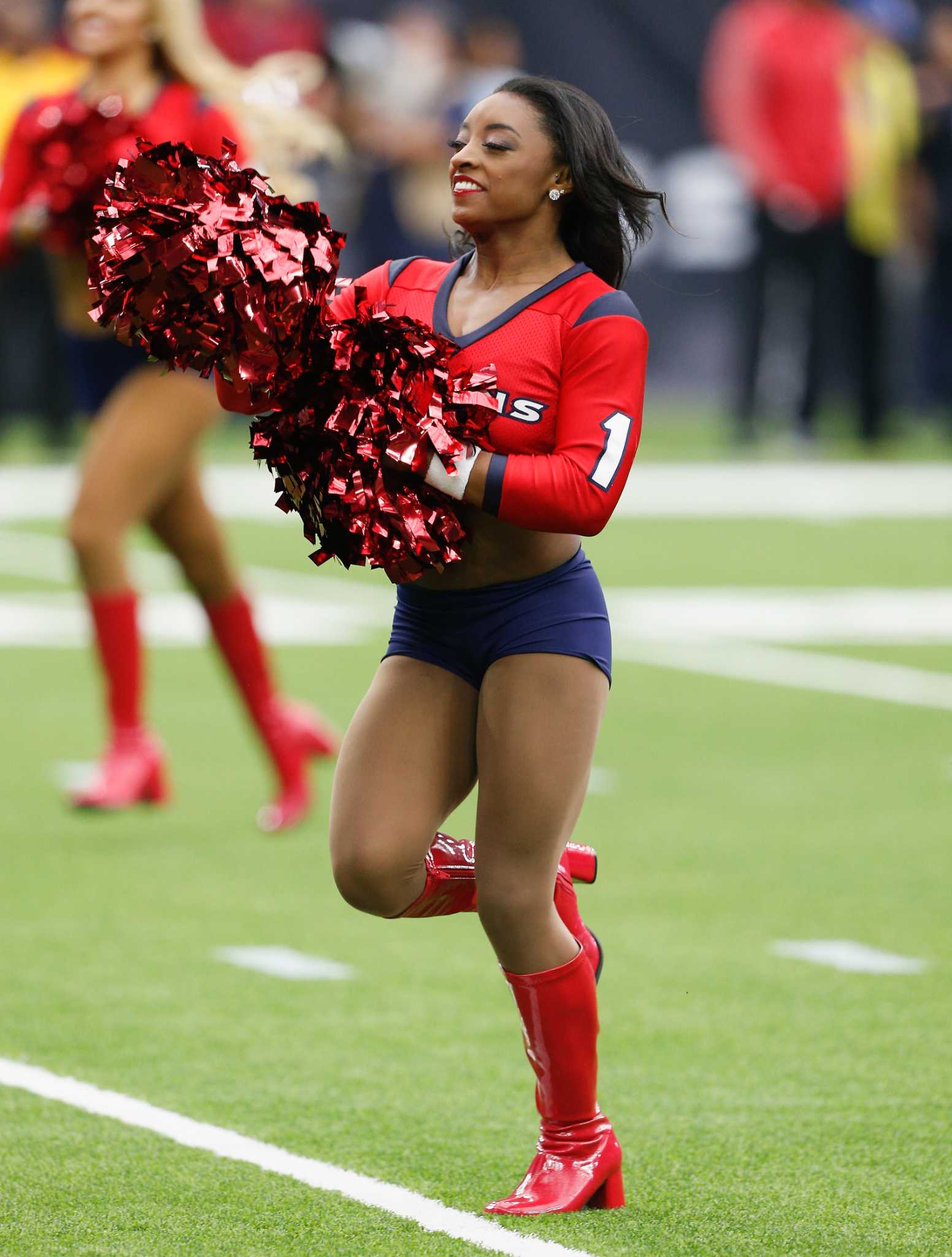 Simone Biles appears as guest Texans cheerleader