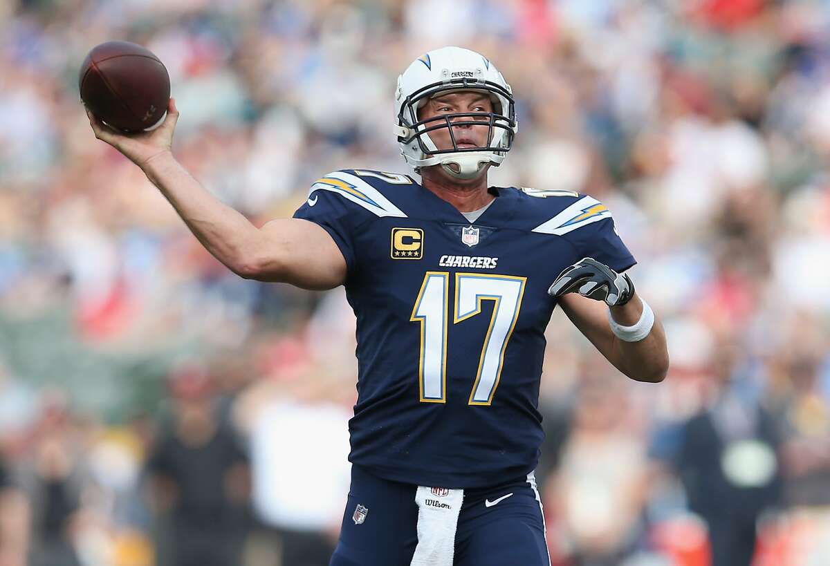 CARSON, CA - DECEMBER 10: Quarterback Philip Rivers #17 of the Los Angeles Chargers throws an eight yard touchdown pass in the first quarter against the Washington Redskins on December 10, 2017 at StubHub Center in Carson, California. (Photo by Stephen Dunn/Getty Images)