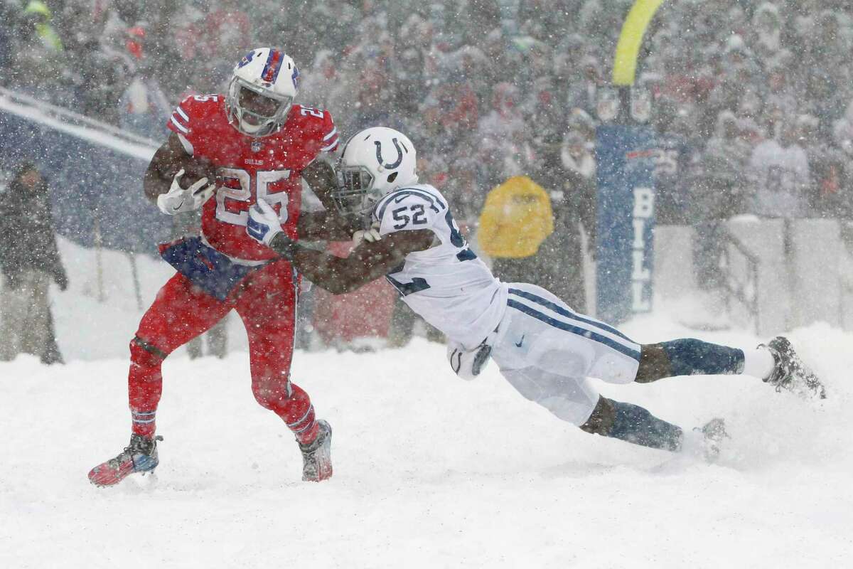 Indianapolis Colts outside linebacker Barkevious Mingo, right, tries to tackle Buffalo Bills running back LeSean McCoy during the second half of an NFL football game, Sunday, Dec. 10, 2017, in Orchard Park, N.Y. (AP Photo/Jeffrey T. Barnes) ORG XMIT: NYSW117