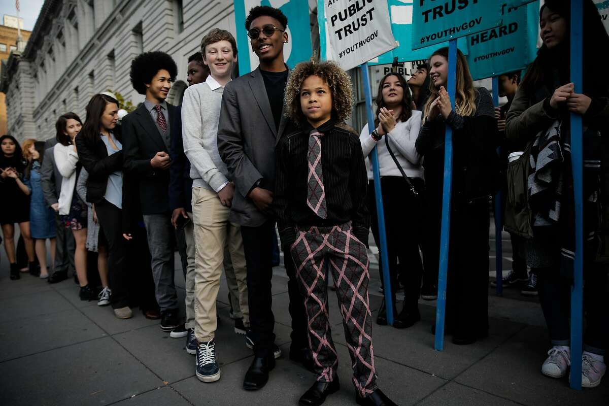 Levi Draheim, 10 (center) and other youth activists suing the Trump administration over climate change in San Francisco, Calif., on Monday, Dec. 11, 2017.