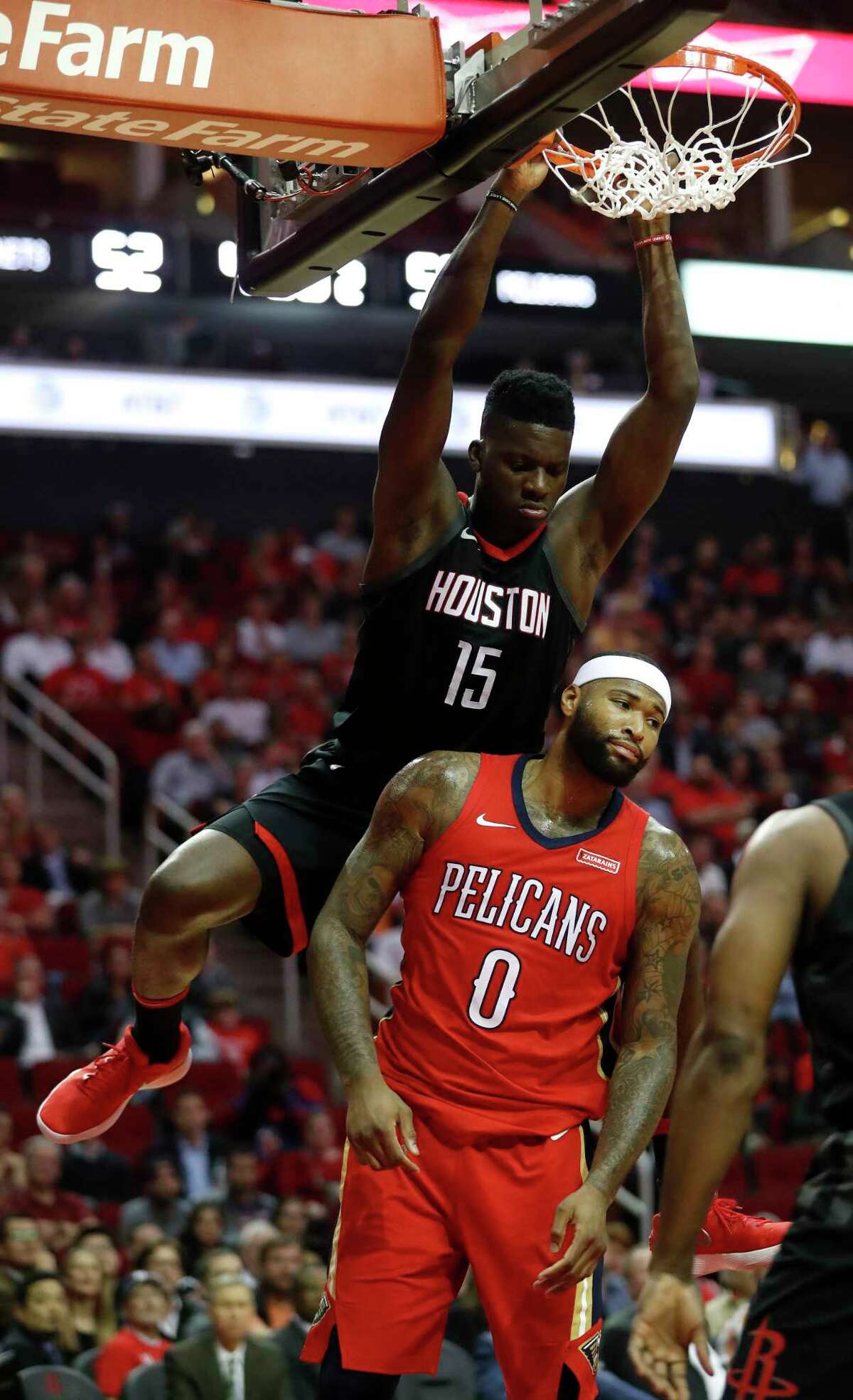 Houston Rockets center Clint Capela (15) dunks the ball over New Orleans Pelicans center DeMarcus Cousins (0) during the first half of an NBA game at Toyota Center, Monday, Dec. 11, 2017, in Houston.