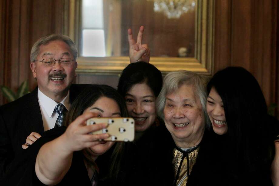 Mayor Ed Lee (left) clowns around during a photo with his daughter Tania Lee, wife Anita Lee, mother Pansy Lee and daughter Brianna Lee at City Hall in 2015. Photo: Lea Suzuki, The Chronicle