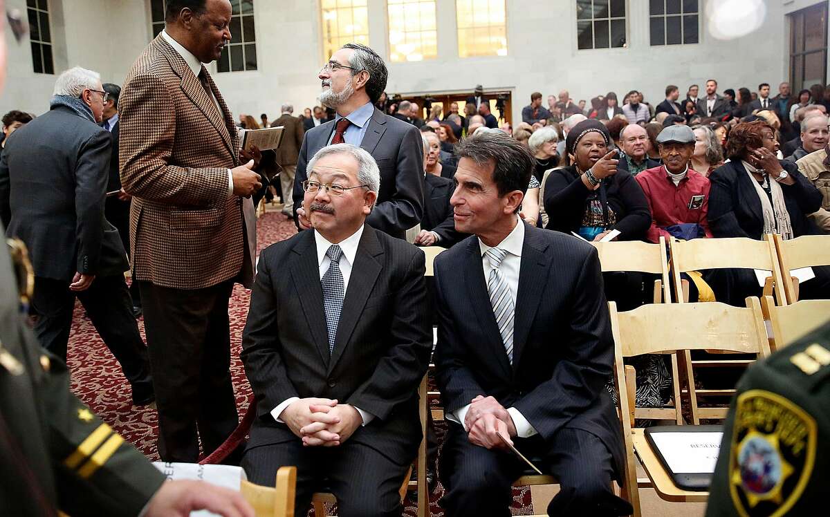 Mayor Ed Lee and senator Mark Leno chat before sheriff Vicki Hennessy is sworn into office at city hall in San Francisco, California, on Friday, January 8, 2015.