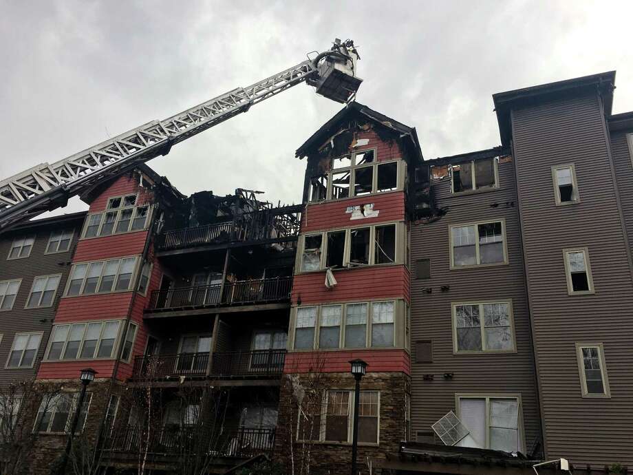 Cause Determined In Condo Blaze The Hour A Firefighter Inspects The Wreckage Of 54 Unit Condo In Norwalk Conn