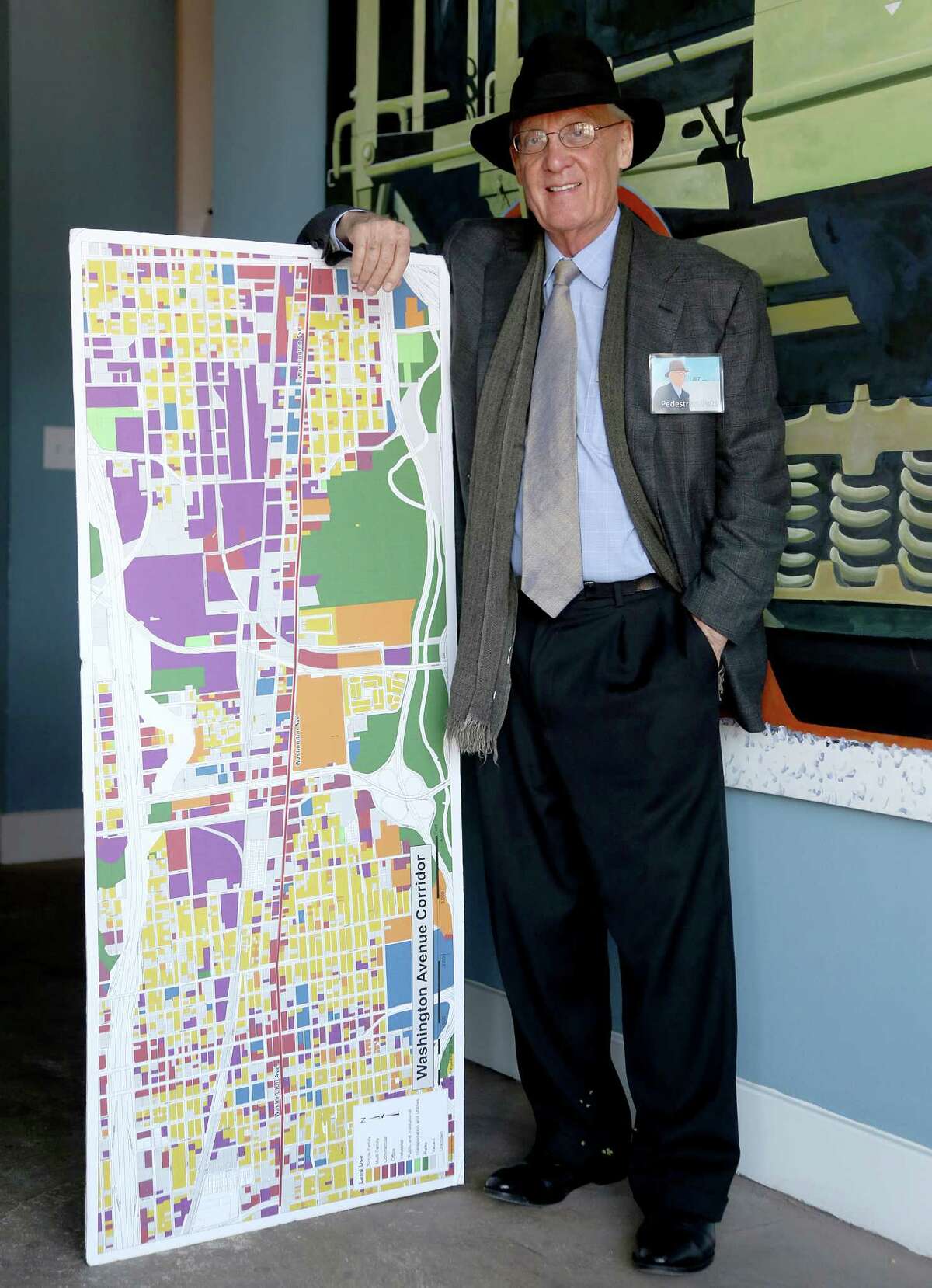 11/20/12: Pete Brown with a map of Washington Street. After very seriously running in 2009, architect and former city council member Peter Brown has transformed himself into Houston's leading utopian. His group, Better Houston, promotes urban planning and walkability. In on-line videos, Brown turns himself into a Stephen Colbert-like character, "Pedestrian Pete," who walks around the city with guests, chatting about the good, the bad and the ugly.