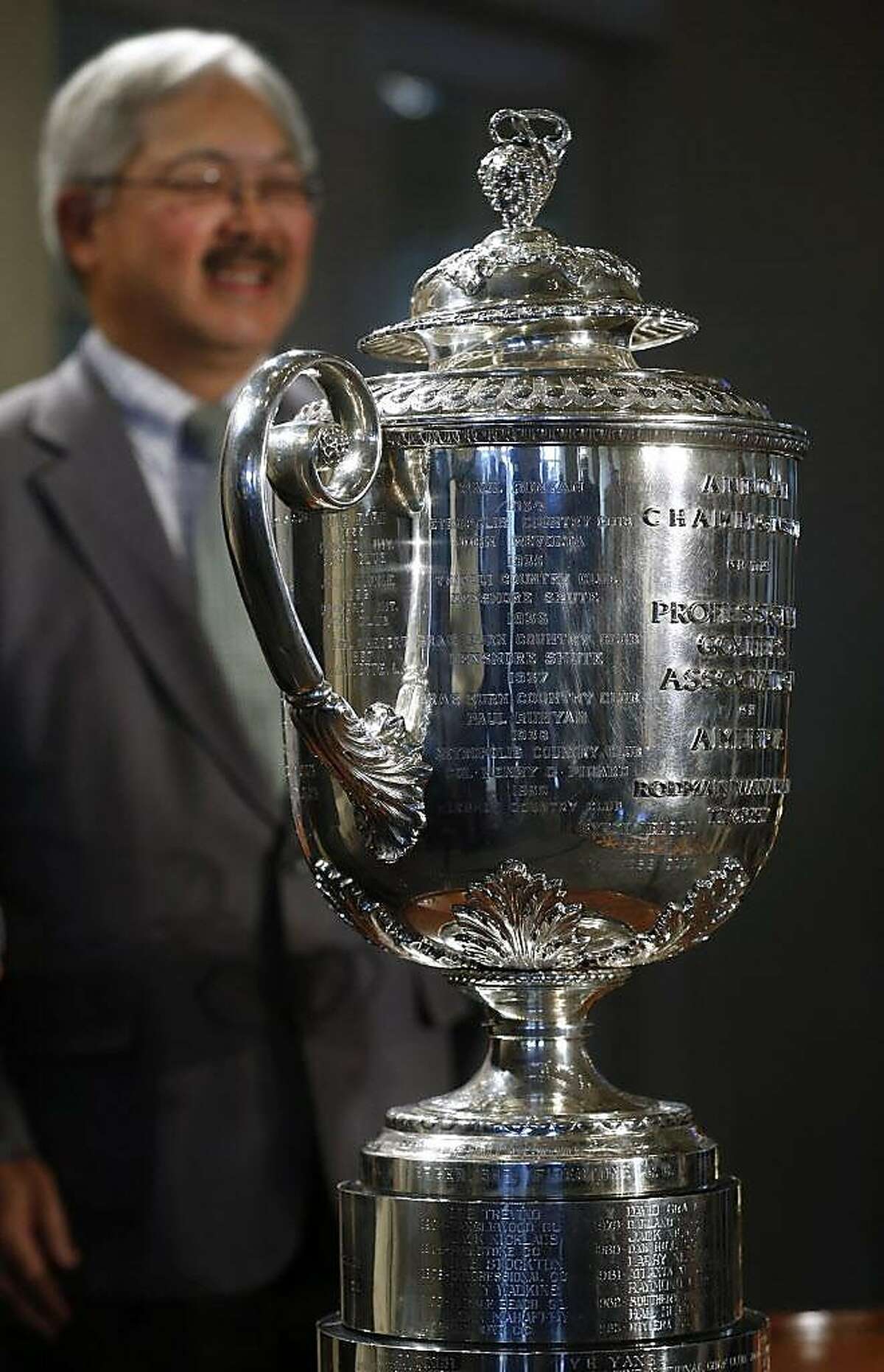 Mayor Ed Lee stands behind the Wanamaker Trophy during an event at the Olympic Club in San Francisco, Calif. on Wednesday, Nov. 8, 2017 to announce that the club will host the 2028 PGA Championship and the Ryder Cup in 2032.