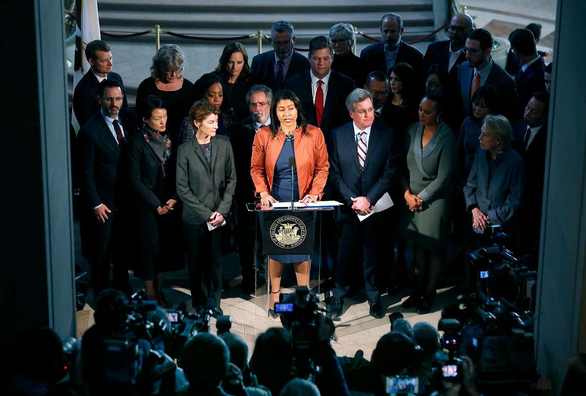 Acting Mayor London Breed is surrounded by city officials during a City Hall news conference following the announcement that Mayor Ed Lee has died in San Francisco, Calif. on Tuesday, Dec. 12, 2017.