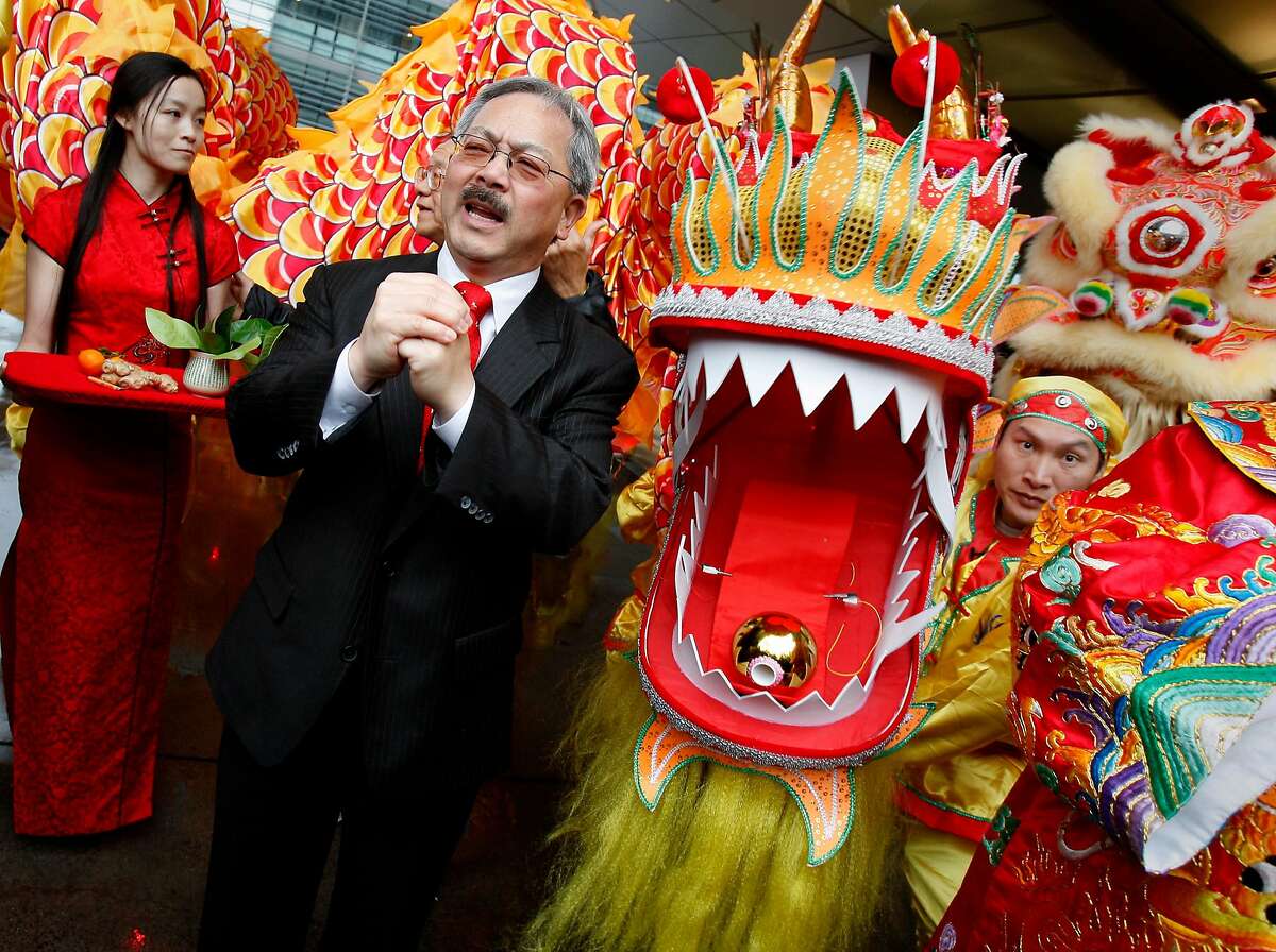 FILE-- Mayor Ed Lee helped decorate the new dragon (right) being unveiled and gave a speech. Hundreds turned out to celebrate the first day of the Chinese New Year in Chinatown Monday January 23, 2012 including San Francisco Mayor Ed Lee.