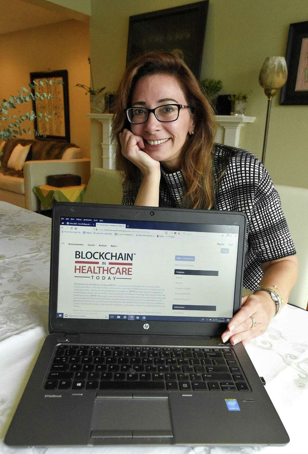 Tory Cenaj, founder and publisher of the new online journal Blockchain in Healthcare Today, is photographed, on Dec. 5, 2017, at her home in Stamford, Conn.