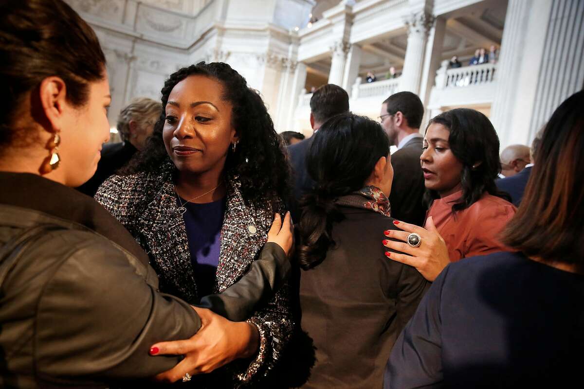 Supevisor Malia Cohen (second from left) and Acting Mayor London Breed (right) mourn with others attending a press conference outside the Mayor's Office at City Hall on Tuesday, December 12, 2017 in San Francisco, Calif. In a statement this morning, officials from the mayor's office said that Lee passed away at 1:11 a.m. at the Zuckerberg San Francisco General Hospital. Lee was 65 years old.