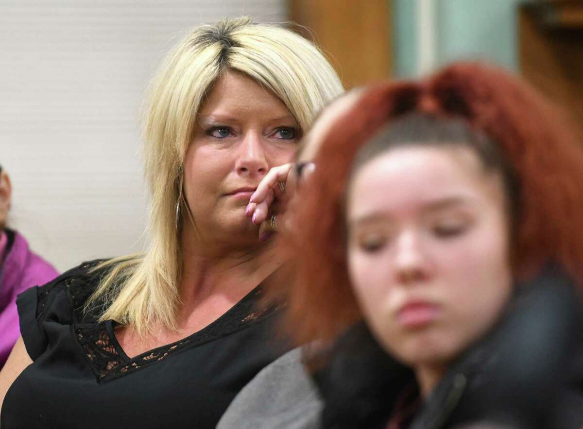 Brenda Morse, left, listens with tears in her eyes, as residents of Cohoes speak in support for her husband Mayor Shawn Morse who leads a public meeting with the Cohoes Common Council at Cohoes City Hall on Tuesday, Dec. 12, 2017 in Cohoes, N.Y. (Lori Van Buren / Times Union)