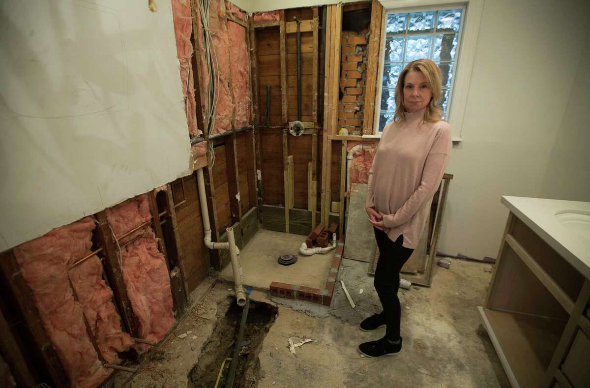 Valerie Caraway, whose house flooded during Harvey, has been paying out of pocket for many of the repairs to her home, Wednesday, Dec. 6, 2017, in Houston. Caraway has flood insurance and has received several checks, but the mortgage company servicing her loan has been slow to release the money. She is concerned about her finances going forward if she can't get the money to fund the improvements. In the meantime, she's living with a friend.( Mark Mulligan / Houston Chronicle )