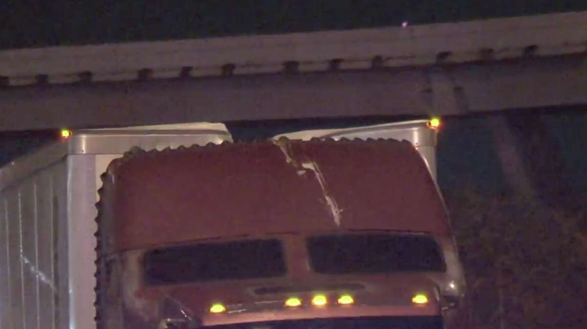 Five semi-trucks hit a steel beam dangling from the Houston Avenue bridge while traveling on I-10 East early Wednesday morning.