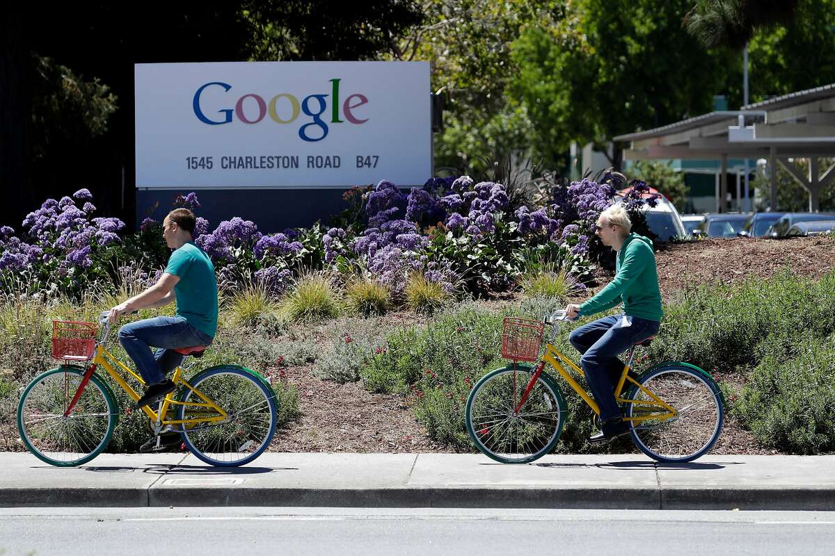 Cyclists ride past a Google sign at the company's headquarters Tuesday, July 19, 2016, in Mountain View, Calif. (AP Photo/Marcio Jose Sanchez)