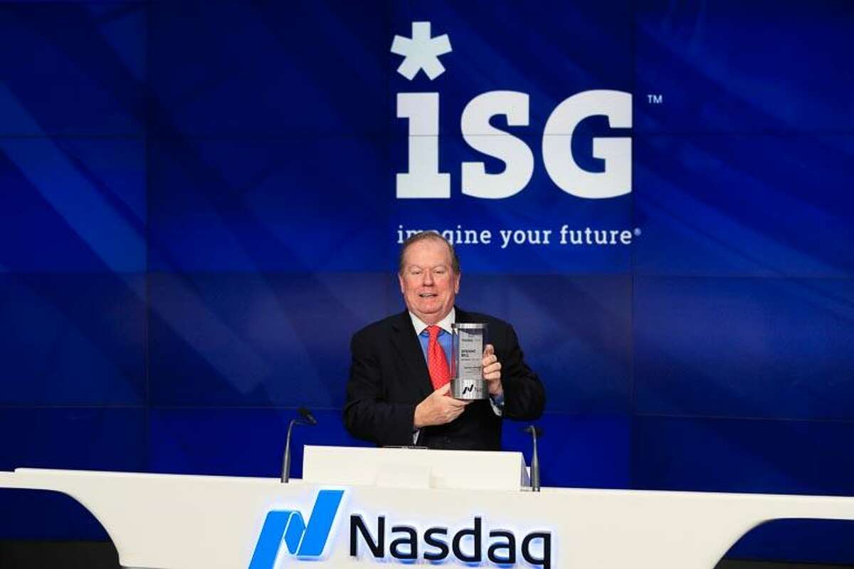 Information Services Group CEO and Chairman Michael Connors, center rang the Nasdaq stock exchange’s opening bell in New York, N.Y., on Wednesday, Dec. 13, 2017, to mark the Stamford-based company’s upcoming 10th anniversary as a Nasdaq-listed company