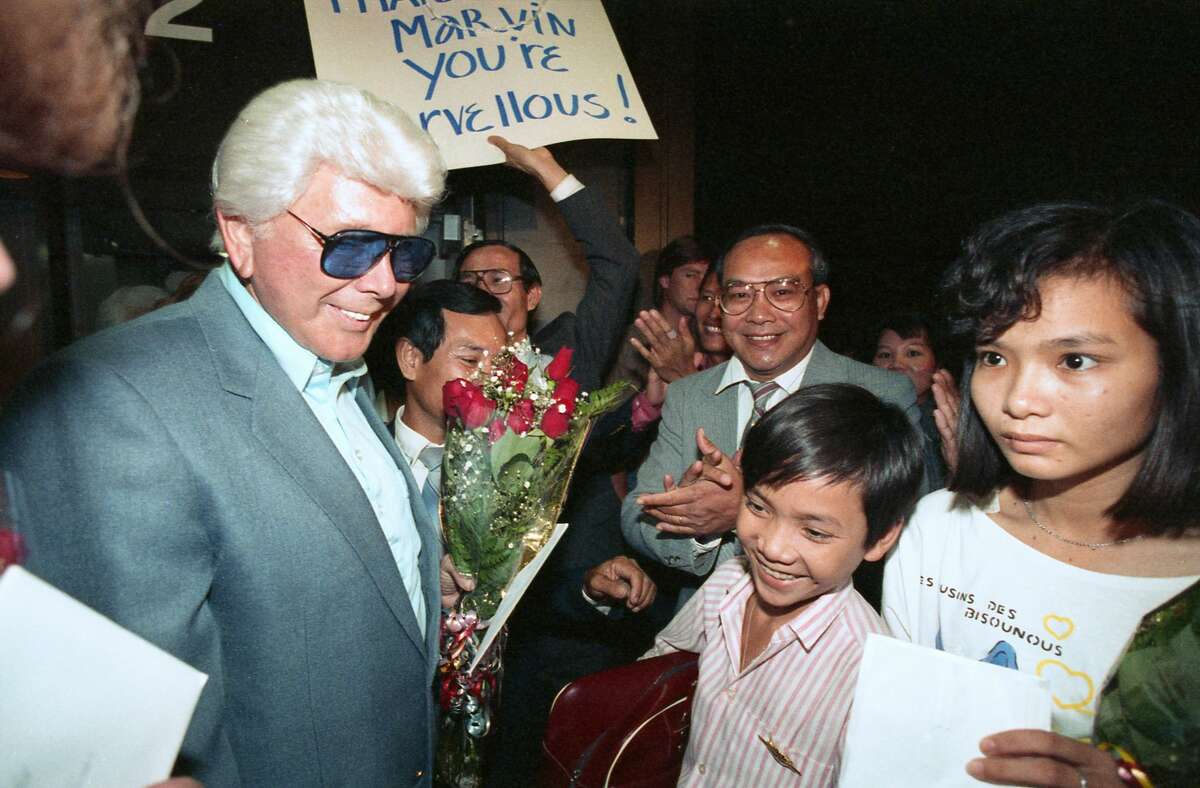 Marvin Zindler was a "champion of Houston." Here, Zindler helps welcome Hoang Nguyen, 13, bottom right, to Houston. Zindler traveled to Vietnam to bring Nguyen and his sister, Kim, 16, at right, to Houston to be reunited with their father, Son Van Nguyen. The family was separated 13 years ago by the Vietnam War. Zindler's efforts then resulted in the U.S. State Department negotiating a program where 2,000 Vietnamese will be released monthly to their families in this country.